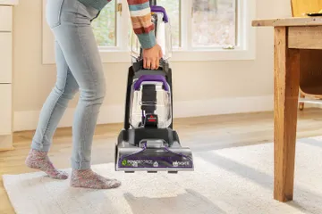 Lifting and moving machine across room