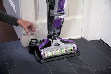 Pouring Self Cleanout formula into storage tray.