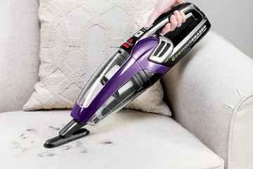 Cleaning a mess with a handheld vacuum