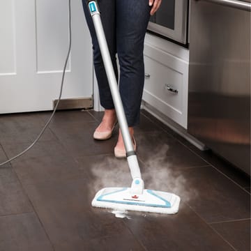 PowerFresh Slim 3-in-1 Steam Mop Steaming Spill on hard flooring.