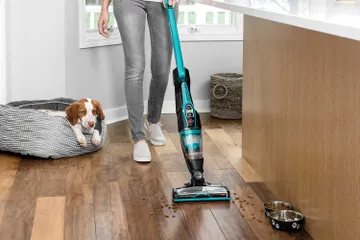 ReadyClean Cordless Stick Vac switching from area rug to hard flooring