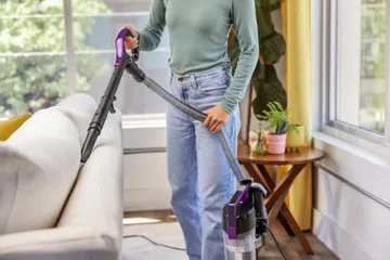 CleanView Compact using hose to vacuum furniture