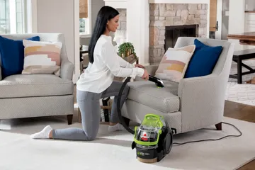 Using Pet Stain Tool to Deep Clean seat inside vehicle.