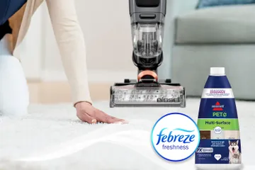 Running hand across dry carpet with bottle of Pet Multi-Surface with Febreze formula bottle and Febreze Logo