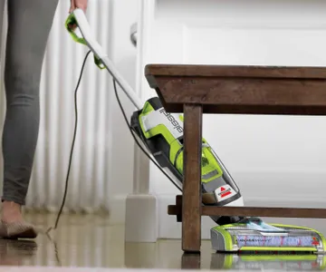 CrossWave Turbo Hard Floor and Area Rug Wet Dry Vac cleaning hard flooring under table.