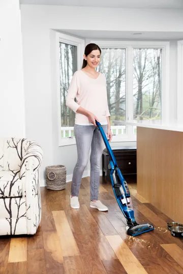 ReadyClean Cordless Stick Vac switching from area rug to hard flooring