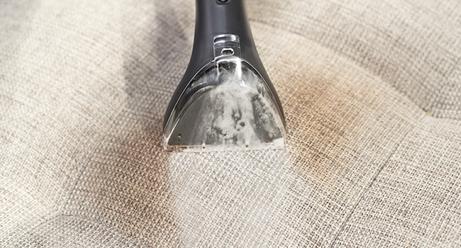 Little Green cleaning stain from light colored upholstery on office chair