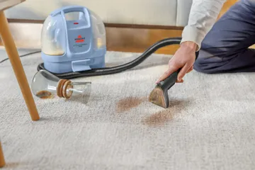 Little Green Mini deep cleaning spill on carpet