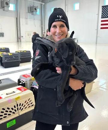 Cathy with dog inside transport center