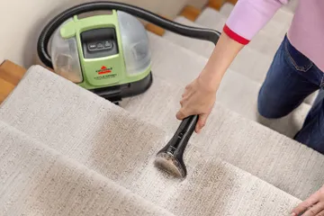Little Green Mini cleaning dirty stair carpet