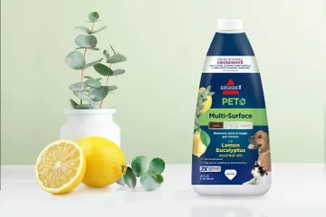 Bottle of PET Multi-Surface Lemon Eucalyptus formula bottle surrounded by lemons