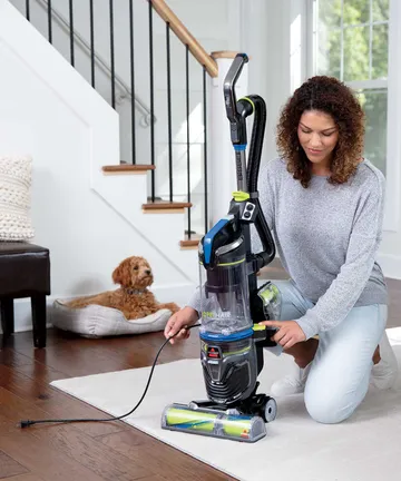 Rewinding Cord back into Pet Hair Eraser Tubo Rewind Vacuum Cleaner.
