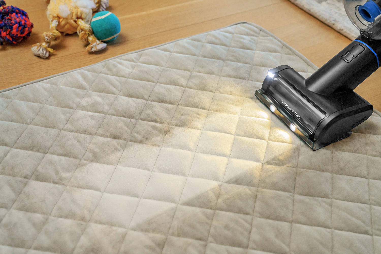 PowerClean FurFinder removing pet hair and dirt from dog bed