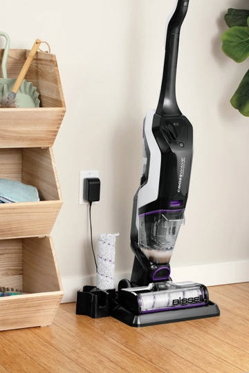 CrossWave Cordless Max Multi-Surface Wet Dry Vac on storage cleaning try with brush roll in holder. 
