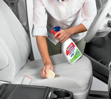 INSTAclean Stain & Odor Remover being used to remove stain off car upholstery.