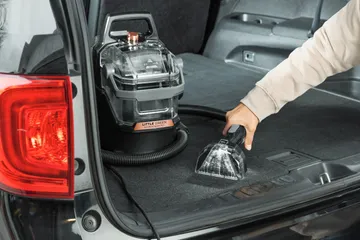 Little Green HydroSteam Pet cleaning car upholstery.