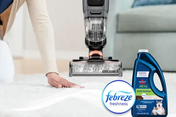 Running hand across dry carpet with bottle of Pet Multi-Surface with Febreze formula bottle and Febreze Logo