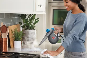 Using Steam Shot to steam kitchen counter near stove