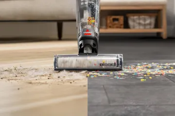 CrossWave vacuuming and mopping multiple hard surfaces