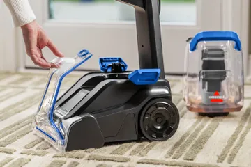 Removing nozzle from foot of machine