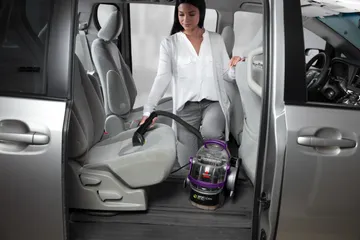 Using SpotClean Pet Pro Portable Carpet cleaner to deep clean car interior