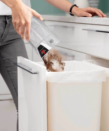Emptying Dirt Bin into Trash.