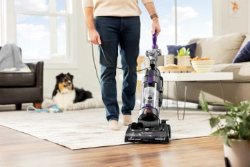 CleanView Compact Turbo Vacuum moving from area rug to hard flooring