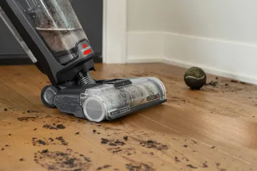 CrossWave Vacuuming and mopping dirt from hard floors
