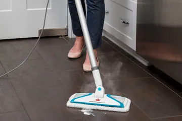 PowerFresh Slim 3-in-1 Steam Mop Steaming Spill on hard flooring.
