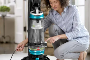 Rewiding cord back into CleanView Swivel Rewind Pet Vacuum.