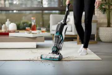 CrossWave Cordless Max Multi-Surface Wet Dry Vac switching from area rug to hard flooring