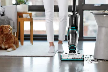 CrossWave Cordless Max Multi-Surface Wet Dry Vac mopping and vacuuming spilled mess on tile flooring