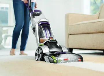 ProHeat 2X Revolution Pet Pro Carpet Cleaner cleaning dirt from carpet.