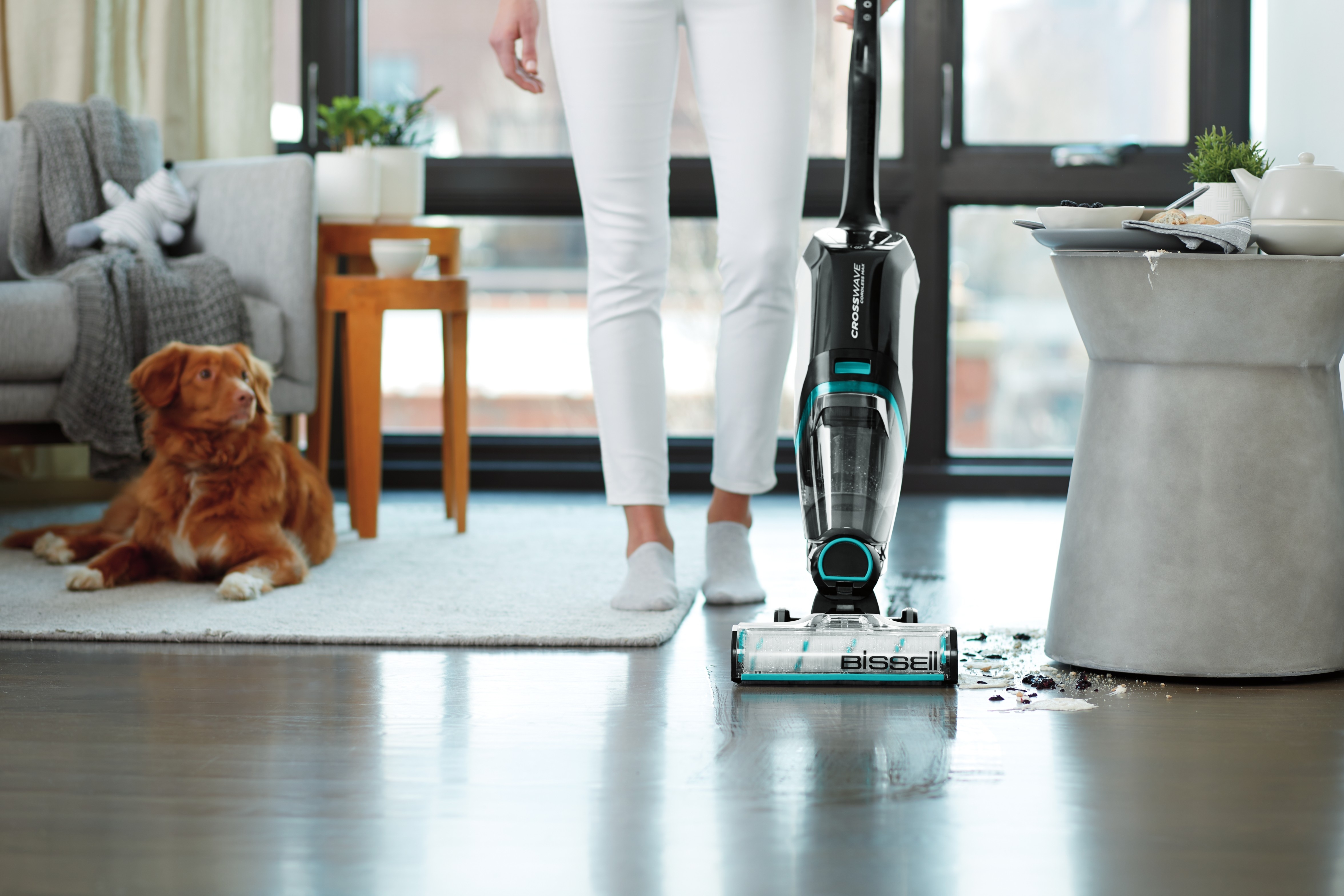 CrossWave Cordless Max cleaning wet mess off hard flooring in living room.