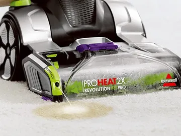 ProHeat 2x cleanshot pretreater spraying a stain with carpet solution