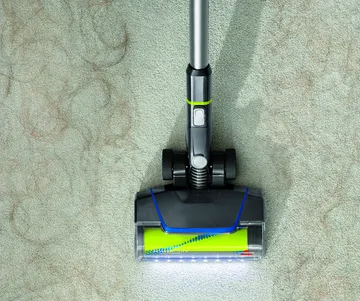 CleanView Pet Slim Cordless Stick Vac Vacuuming up pet hair from carpet.