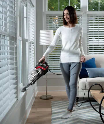 Using Hand Vac with Dusting Brush to clean sills.