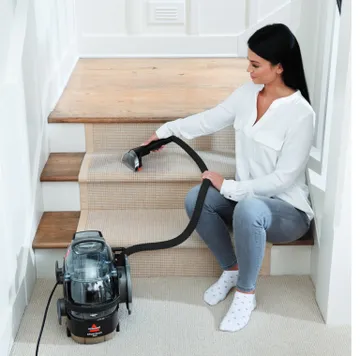 Using SpotClean Pro Portable Carpet Cleaner to deep clean stairs.